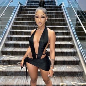 • Black halter mini dress with deep V cut.